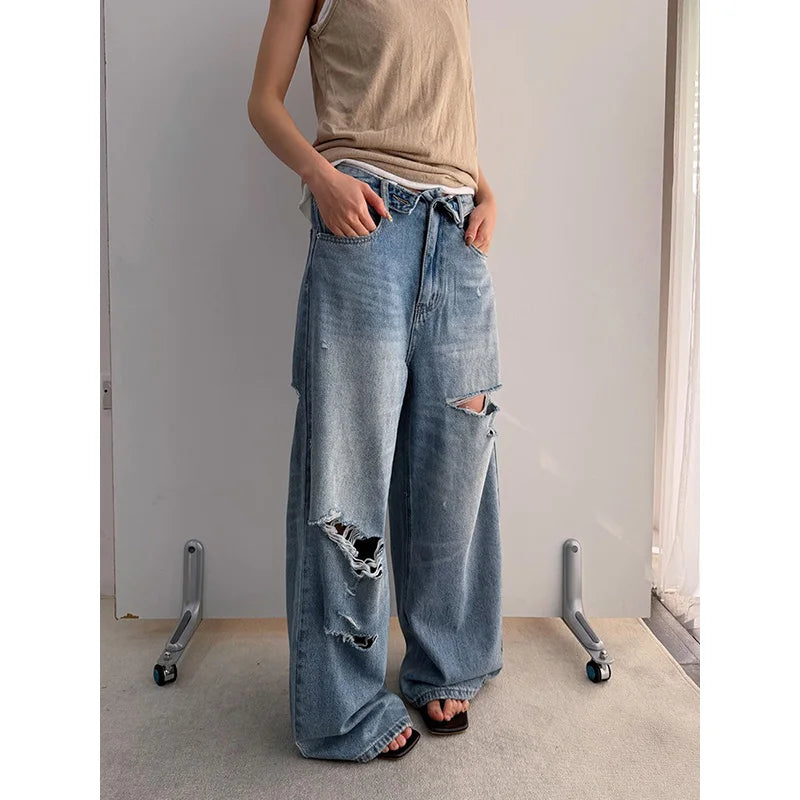 Vintage Washed Wide-Leg Jeans with Distressed Cuff Detail