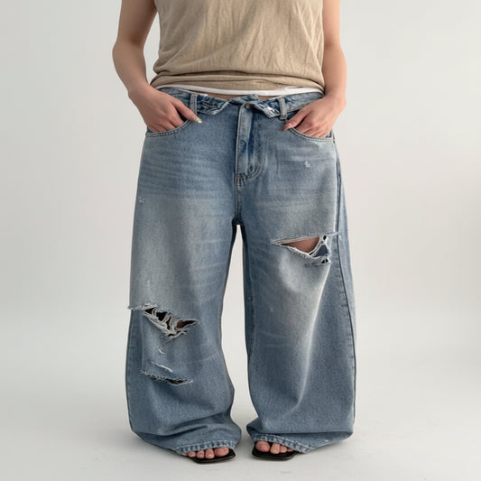 Vintage Washed Wide-Leg Jeans with Distressed Cuff Detail