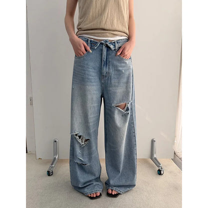 Vintage Washed Wide-Leg Jeans with Distressed Cuff Detail