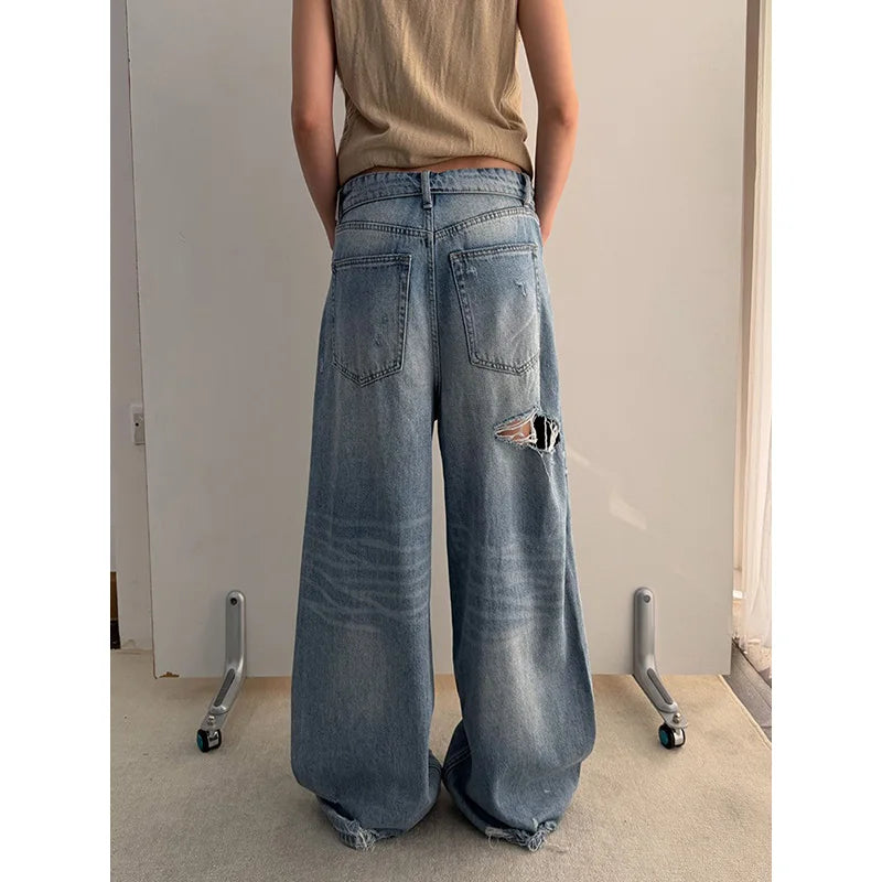 Vintage Washed Wide-Leg Jeans with Distressed Cuff Detail