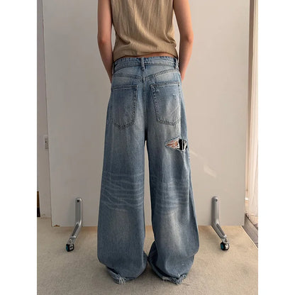 Vintage Washed Wide-Leg Jeans with Distressed Cuff Detail